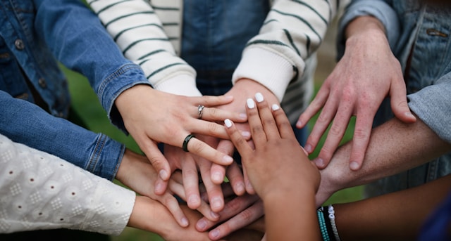 Hands-in a team huddle. Togetherness